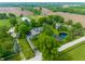 Aerial view of a private estate with a pond, barn, and lush landscaping at 11823 E 200 S, Zionsville, IN 46077
