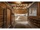 Indoor arena featuring a sanded surface and exposed wooden ceiling beams at 11823 E 200 S, Zionsville, IN 46077