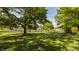 Lush backyard featuring mature trees, well-maintained lawn, and a peaceful setting at 11823 E 200 S, Zionsville, IN 46077