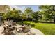 Beautiful backyard featuring a spacious wooden deck with outdoor seating, lush green lawn, and mature trees for shade and privacy at 11823 E 200 S, Zionsville, IN 46077