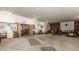 Spacious barn interior with tractor, lawn care equipment, and utility sink at 11823 E 200 S, Zionsville, IN 46077