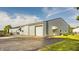 Spacious barn with multiple entry points, ample parking, and a well-maintained exterior, perfect for a variety of uses at 11823 E 200 S, Zionsville, IN 46077
