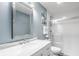 Bright bathroom featuring a sleek vanity with mirror, and a glass-enclosed shower offering a clean, modern aesthetic at 11823 E 200 S, Zionsville, IN 46077