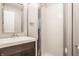Modern bathroom featuring a vanity with a dark wood cabinet and a glass-enclosed shower stall at 11823 E 200 S, Zionsville, IN 46077
