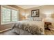 Comfortable bedroom showcasing a large window, plush carpeting, and neutral tones that create a cozy retreat at 11823 E 200 S, Zionsville, IN 46077