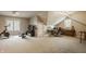 Versatile bonus room featuring gym equipment and a home office space under a vaulted ceiling at 11823 E 200 S, Zionsville, IN 46077