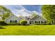 Charming home with a lush lawn, mature trees, and inviting curb appeal at 11823 E 200 S, Zionsville, IN 46077