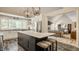 Spacious kitchen featuring a marble island with seating that opens to living space at 11823 E 200 S, Zionsville, IN 46077