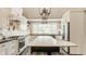 Bright kitchen features white cabinetry, stainless steel appliances, and a large window at 11823 E 200 S, Zionsville, IN 46077