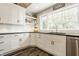 Bright kitchen featuring white cabinetry, dark countertops, and stainless steel appliances at 11823 E 200 S, Zionsville, IN 46077