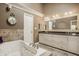 Spacious main bathroom with a soaking tub, double vanity, and decorative backsplash creating a luxurious space at 11823 E 200 S, Zionsville, IN 46077