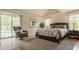Serene main bedroom with a king bed, vaulted ceilings, and natural light from multiple windows at 11823 E 200 S, Zionsville, IN 46077
