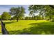Expansive lush pasture with horses grazing, surrounded by mature trees and wooden fencing at 11823 E 200 S, Zionsville, IN 46077