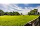 Lush green pasture with horses grazing under a blue sky with wispy clouds at 11823 E 200 S, Zionsville, IN 46077