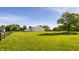 Expansive green property with a large white barn and black fencing at 11823 E 200 S, Zionsville, IN 46077