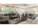 Bright sunroom featuring large windows, comfortable seating, and decorative lighting for a relaxing atmosphere at 11823 E 200 S, Zionsville, IN 46077