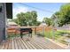 Backyard deck area, featuring a grill, and views of the fenced-in yard, and the surrounding neighborhood at 1205 N Temple Ave, Indianapolis, IN 46201
