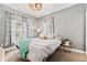 Bright bedroom with stylish decor and a cozy atmosphere and carpeted floor at 1205 N Temple Ave, Indianapolis, IN 46201