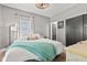 Serene bedroom with plush bedding, soft lighting, and ample closet space at 1205 N Temple Ave, Indianapolis, IN 46201