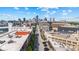 Overhead view of city streets with buildings on both sides and a skyline in the background on a sunny day at 1205 N Temple Ave, Indianapolis, IN 46201