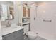 Bright bathroom featuring a walk-in shower, gray vanity, and a decorative cabinet for storage at 1219 Citation W Cir, Lebanon, IN 46052