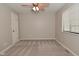 Bedroom features neutral carpet and a ceiling fan with lighting at 1219 Citation W Cir, Lebanon, IN 46052