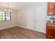 Open dining area with wood-look floors, bright lighting, and convenient access to the kitchen at 1219 Citation W Cir, Lebanon, IN 46052