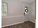 Bright entryway with wood-look floors, wainscoting detail, and a modern front door at 1219 Citation W Cir, Lebanon, IN 46052