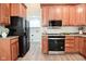 Well-appointed kitchen with ample wood cabinets, modern appliances, and bright lighting at 1219 Citation W Cir, Lebanon, IN 46052