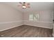 Neutral living room featuring wood-look flooring and abundant natural light at 1219 Citation W Cir, Lebanon, IN 46052