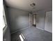 A bright bedroom featuring fresh paint, new carpet, a closet, and an attached bathroom entrance at 1359 S Mulberry St, Martinsville, IN 46151