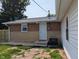 Back exterior of house with white door, brick, and siding with an air conditioning unit at 1359 S Mulberry St, Martinsville, IN 46151