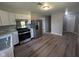 Open-concept kitchen featuring stainless steel appliances and bright, white cabinetry at 1359 S Mulberry St, Martinsville, IN 46151