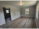 Spacious living room boasts sleek floors and ample space for entertaining at 1359 S Mulberry St, Martinsville, IN 46151
