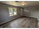 Bright living room features modern floors and a large window for natural light at 1359 S Mulberry St, Martinsville, IN 46151
