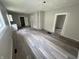 A bright living room featuring modern wood-look floors and neutral walls at 1445 W 34Th St, Indianapolis, IN 46208