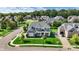 Aerial view of a beautiful gray home with green lawn, landscaping, and neighborhood at 14458 Smickle Ln, Carmel, IN 46033