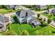 Aerial view of a two-story home with a well-maintained lawn and outdoor deck at 14458 Smickle Ln, Carmel, IN 46033