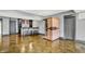 Basement bar and sauna area features sleek flooring, a bar with seating, and a light wood sauna at 14458 Smickle Ln, Carmel, IN 46033
