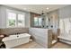 A modern bathroom with a free-standing tub and a walk-in shower at 14458 Smickle Ln, Carmel, IN 46033