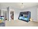 bedroom featuring bunk beds, closet, and a charming chandelier with plenty of storage space at 14458 Smickle Ln, Carmel, IN 46033