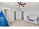 Spacious Bedroom featuring a crib, play tent, closet, and abundant natural light from the large window at 14458 Smickle Ln, Carmel, IN 46033