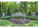 Stone community sign for Cherry Tree Grove surrounded by flowers and greenery at 14458 Smickle Ln, Carmel, IN 46033
