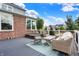 Relaxing outdoor deck with wicker furniture, a hot tub and an outdoor rug at 14458 Smickle Ln, Carmel, IN 46033