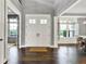 Elegant foyer with hardwood floors, high ceilings, and a view to the formal dining room at 14458 Smickle Ln, Carmel, IN 46033