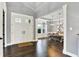 Spacious foyer showcasing hardwood floors and inviting entryway to the dining room at 14458 Smickle Ln, Carmel, IN 46033