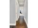 The hallway features hardwood floors with open doorways showing more of the home at 14458 Smickle Ln, Carmel, IN 46033
