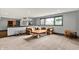 Spacious carpeted basement living room provides a cozy gathering space with a sectional couch and natural light at 14458 Smickle Ln, Carmel, IN 46033
