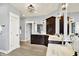 A main bathroom with double vanity and an open entry to the toilet room at 14458 Smickle Ln, Carmel, IN 46033