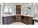 Double sink vanity in main bathroom with stone counters and custom cabinets at 14458 Smickle Ln, Carmel, IN 46033